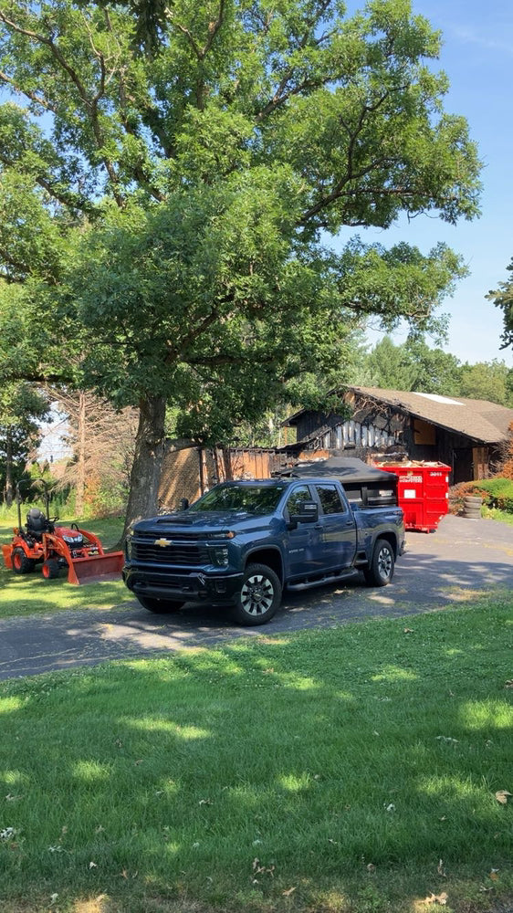 Patriot Clean Out truck hauling away junk for Northwest Indiana property manager.