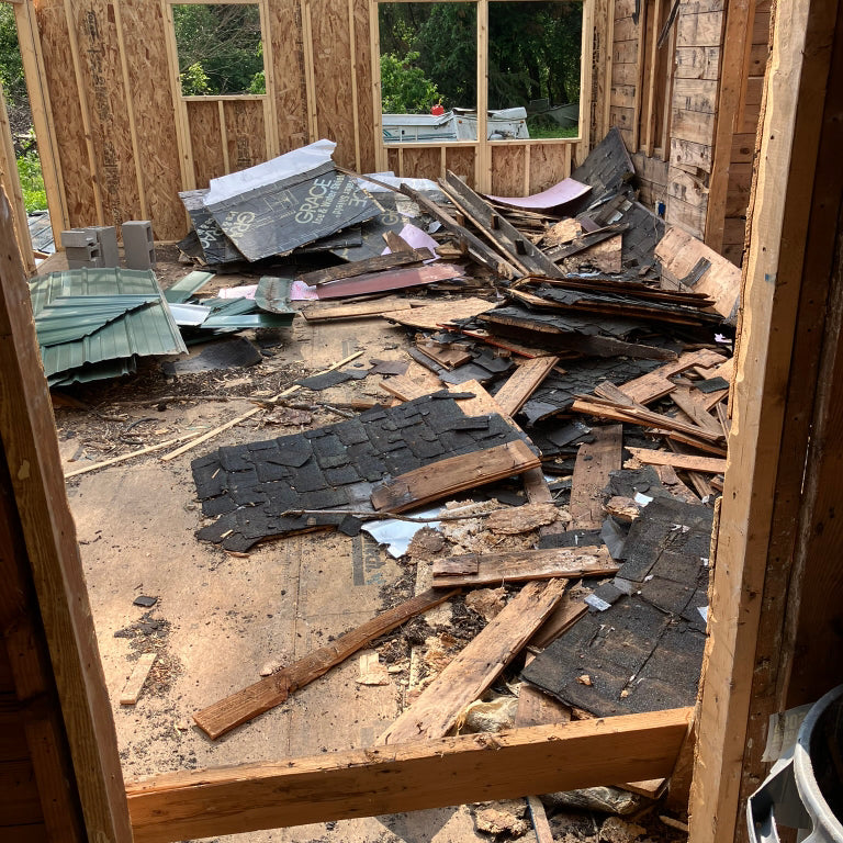 A pile of construction debris being cleared by Patriot Clean Out Services for a local builder in Northwest Indiana. The image represents post-construction cleanup, debris hauling, and site preparation provided by the veteran-owned team for commercial construction projects.