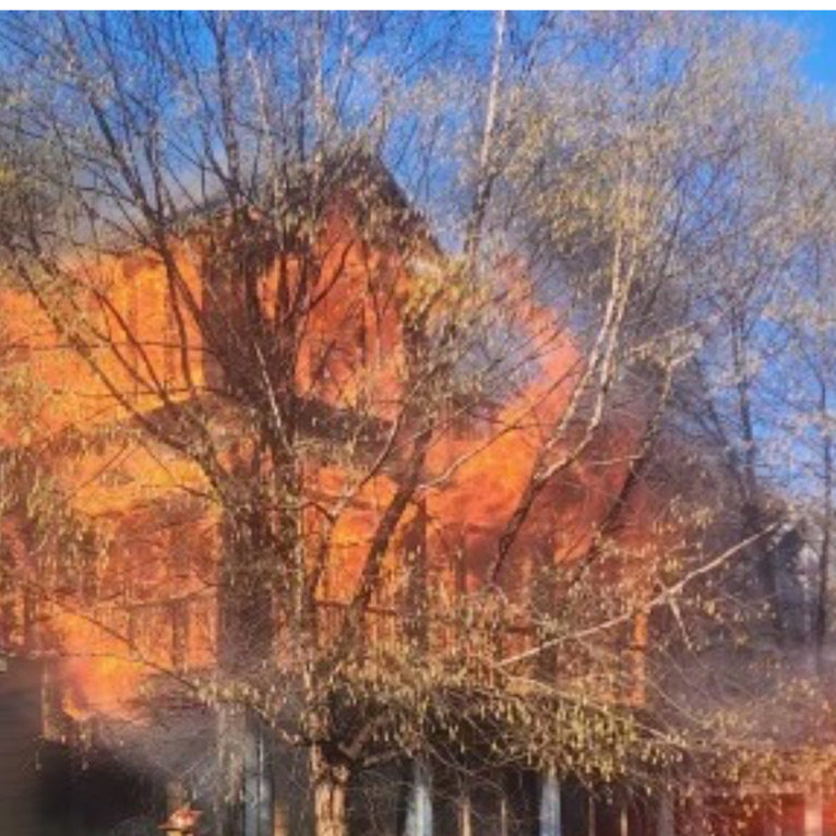 A fire-damaged home being cleared and restored by Patriot Clean Out Services in Northwest Indiana. The image shows post-fire debris removal and cleanup work, representing expert fire recovery and property restoration services for homeowners.